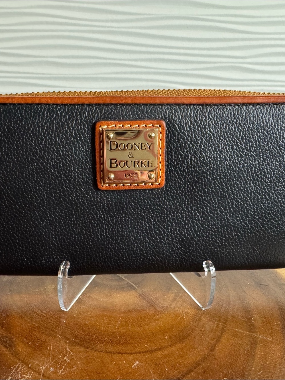 Dooney & Bourke Black Pebbled Leather Zip Wallet with Tan Trim and Logo Plate